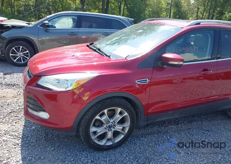 2015 Ford Escape Titanium z USA, uszkodzony, nr VIN 1FMCU9JX7FUA65880
